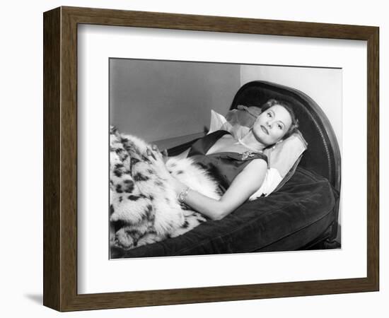 Michèle Morgan Laid on a Bed, 1951-Marcel Begoin-Framed Photographic Print