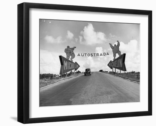 Michelin Man on Billboards at Entrance to the Turin Milan Autostrada-Alfred Eisenstaedt-Framed Photographic Print