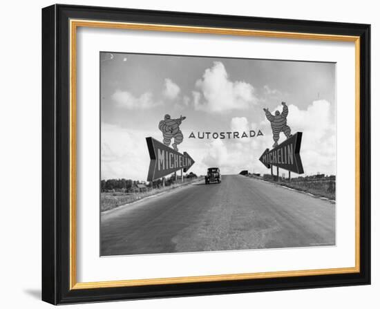 Michelin Man on Billboards at Entrance to the Turin Milan Autostrada-Alfred Eisenstaedt-Framed Photographic Print