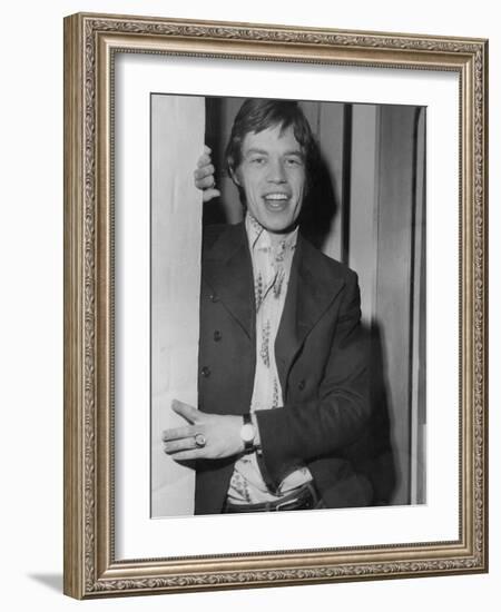 Mick Jagger in a Door-Associated Newspapers-Framed Photo