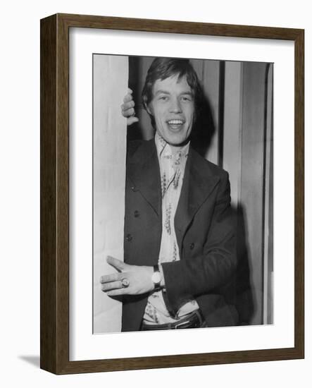 Mick Jagger in a Door-Associated Newspapers-Framed Photo