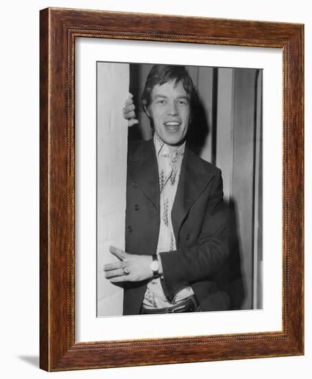 Mick Jagger in a Door-Associated Newspapers-Framed Photo