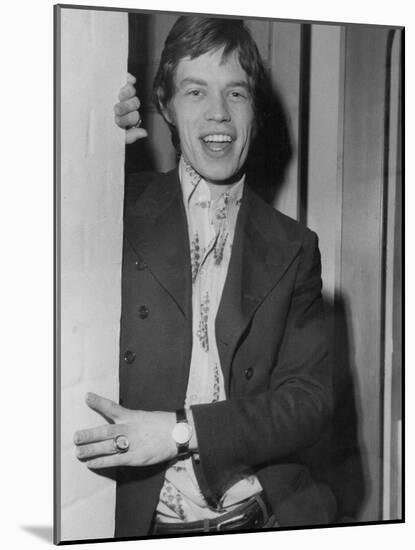 Mick Jagger in a Door-Associated Newspapers-Mounted Photo