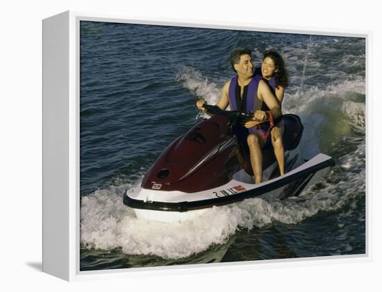 Mid Adult Couple Riding a Jet Ski-null-Framed Premier Image Canvas