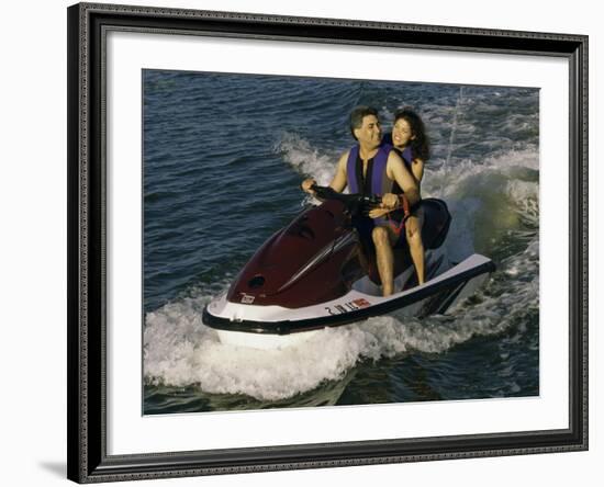 Mid Adult Couple Riding a Jet Ski-null-Framed Photographic Print