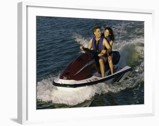 Mid Adult Couple Riding a Jet Ski-null-Framed Photographic Print