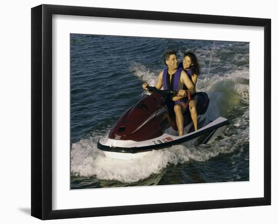 Mid Adult Couple Riding a Jet Ski-null-Framed Photographic Print