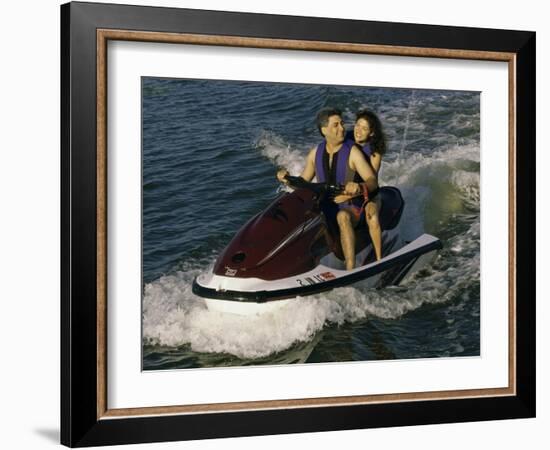 Mid Adult Couple Riding a Jet Ski-null-Framed Photographic Print