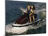 Mid Adult Couple Riding a Jet Ski-null-Mounted Photographic Print