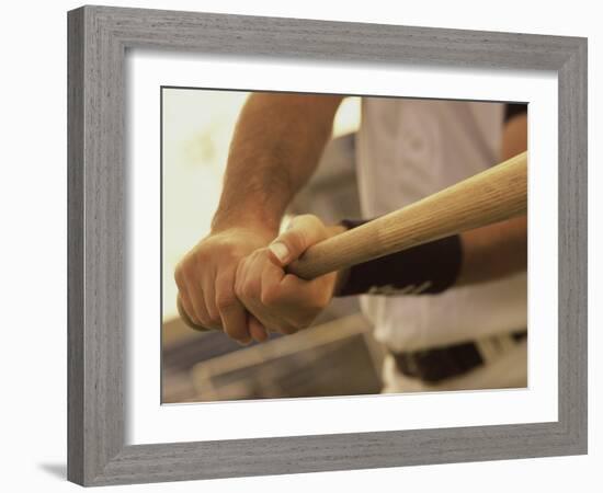 Mid Section View of a Baseball Player Swinging a Baseball Bat-null-Framed Photographic Print