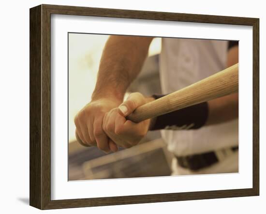 Mid Section View of a Baseball Player Swinging a Baseball Bat-null-Framed Photographic Print