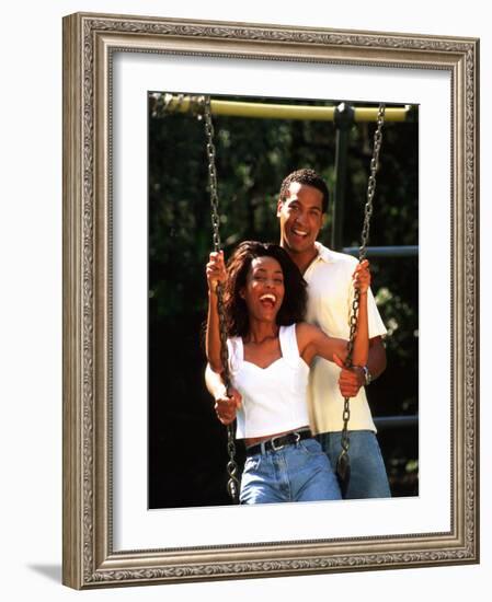 Middle-aged African-American Couple Playing on Swings in the Park-Bill Bachmann-Framed Photographic Print