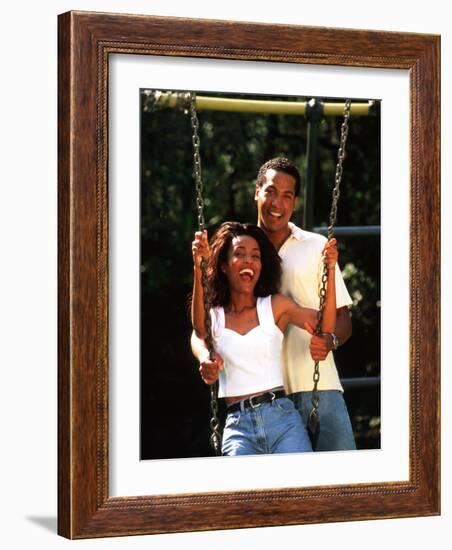 Middle-aged African-American Couple Playing on Swings in the Park-Bill Bachmann-Framed Photographic Print