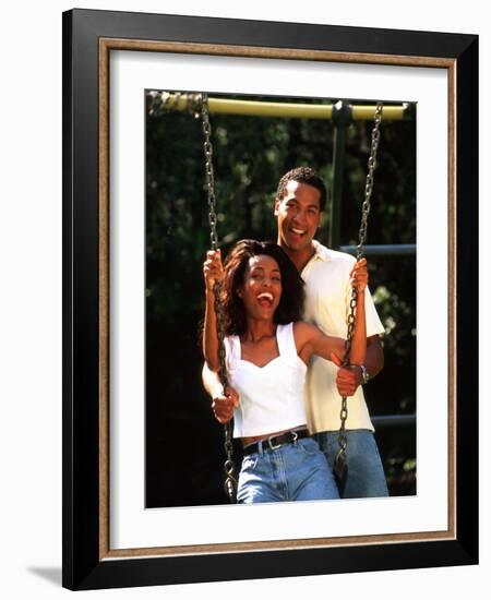 Middle-aged African-American Couple Playing on Swings in the Park-Bill Bachmann-Framed Photographic Print