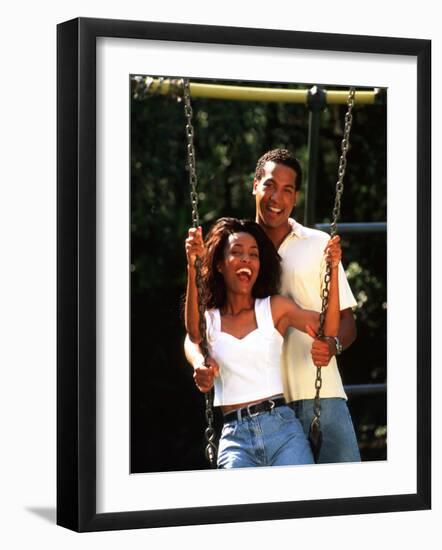 Middle-aged African-American Couple Playing on Swings in the Park-Bill Bachmann-Framed Photographic Print