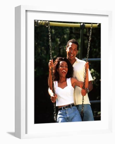 Middle-aged African-American Couple Playing on Swings in the Park-Bill Bachmann-Framed Photographic Print