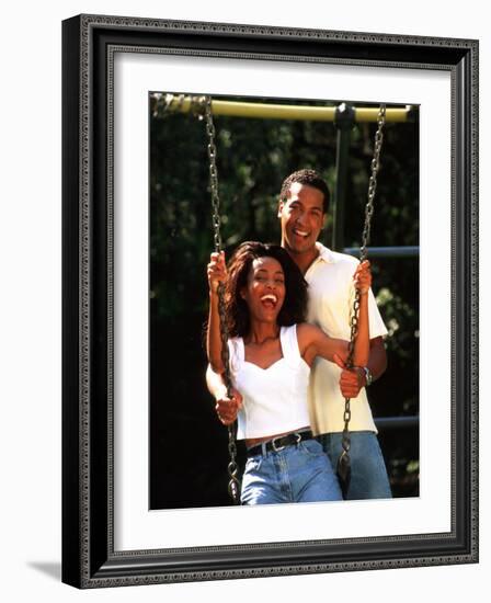 Middle-aged African-American Couple Playing on Swings in the Park-Bill Bachmann-Framed Photographic Print