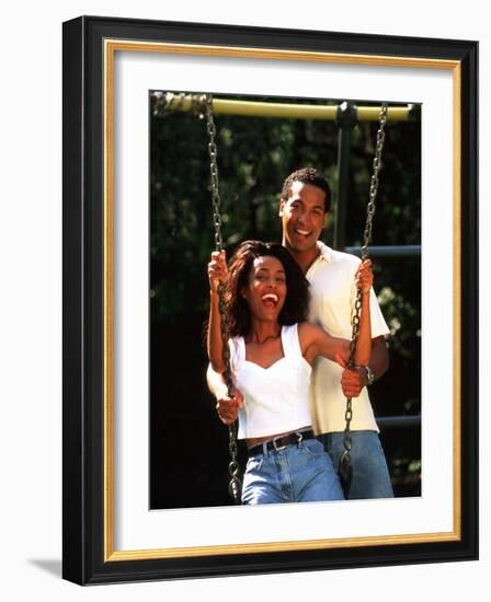 Middle-aged African-American Couple Playing on Swings in the Park-Bill Bachmann-Framed Photographic Print