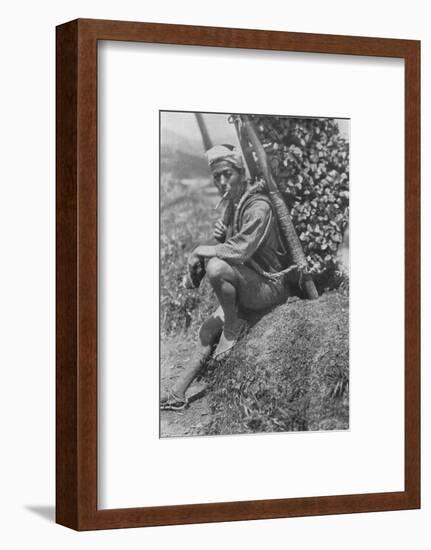 'Middle-aged coolie hurriedly seated himself on the bank to pass us in review', c1900, (1921)-Julian Leonard Street-Framed Photographic Print