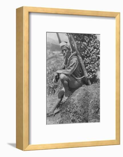 'Middle-aged coolie hurriedly seated himself on the bank to pass us in review', c1900, (1921)-Julian Leonard Street-Framed Photographic Print