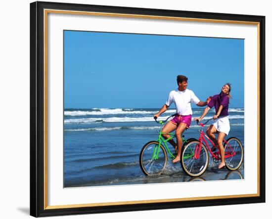 Middle-aged Couple Riding Bikes on the Beach-Bill Bachmann-Framed Photographic Print