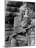 Midwestern Architect Frank Lloyd Wright sits against stone wall-Eliot Elisofon-Mounted Premium Photographic Print