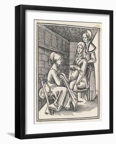 Midwife Discreetly Helps to Deliver a Child While a Friend Supports the Mother-null-Framed Art Print