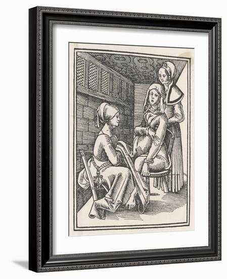 Midwife Discreetly Helps to Deliver a Child While a Friend Supports the Mother-null-Framed Art Print