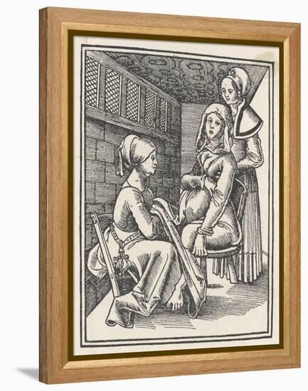Midwife Discreetly Helps to Deliver a Child While a Friend Supports the Mother-null-Framed Stretched Canvas