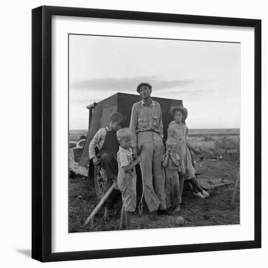 Migrant farm labourer with his children on the road in Texas, 1938-Dorothea Lange-Framed Photographic Print