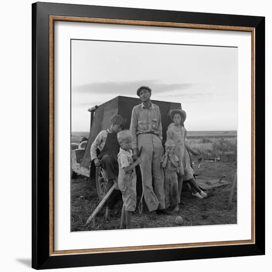 Migrant farm labourer with his children on the road in Texas, 1938-Dorothea Lange-Framed Photographic Print