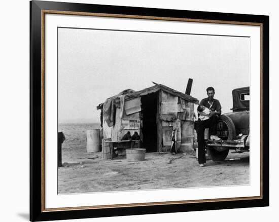 Migrant Father Cradling His Baby Outside Shanty-Dorothea Lange-Framed Premium Photographic Print