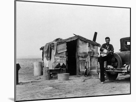 Migrant Father Cradling His Baby Outside Shanty-Dorothea Lange-Mounted Photographic Print