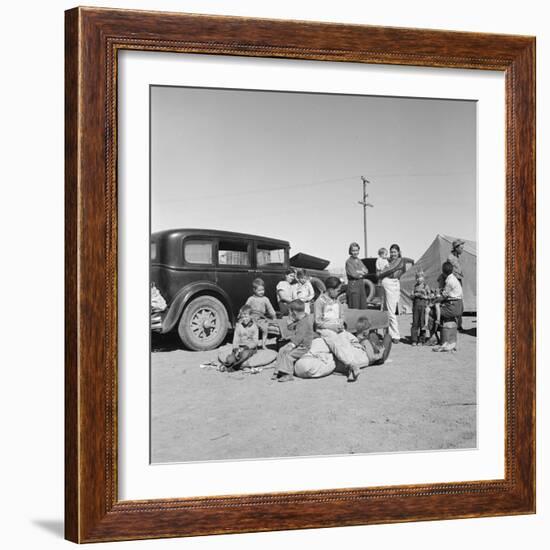 Migrating families camp by the road on their way to California, 1937-Dorothea Lange-Framed Photographic Print