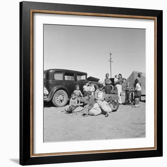 Migrating families camp by the road on their way to California, 1937-Dorothea Lange-Framed Photographic Print