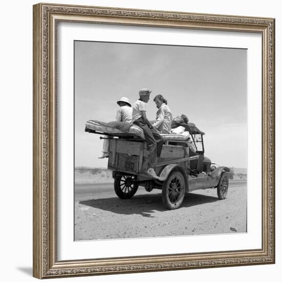 Migratory family traveling in search of work to New Mexico along U.S. Route 70, Arizona, 1937-Dorothea Lange-Framed Photographic Print