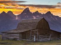 The Moulton Barn Rests Below the Teton Mountains in Grand Teton National Park, Wyoming-Mike Cavaroc-Photographic Print