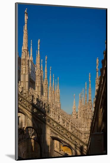 Milan, Milan Province, Lombardy, Italy. Spires on the roof of the Duomo, or cathedral.-null-Mounted Photographic Print