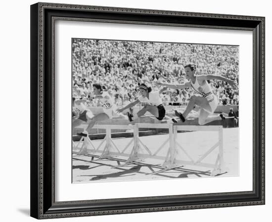 Mildred 'Babe' Didrikson, Running the 80-Meter Hurdles, at the 1932 Olympics-null-Framed Photo