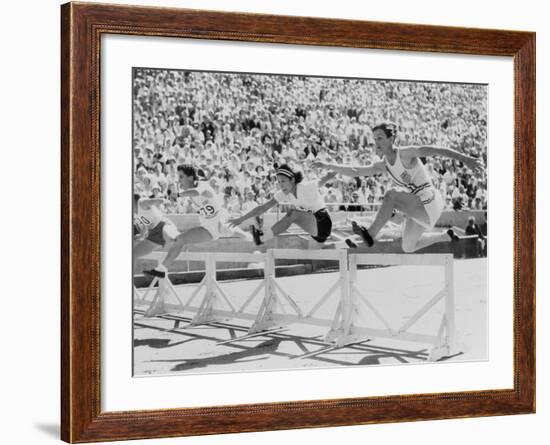 Mildred 'Babe' Didrikson, Running the 80-Meter Hurdles, at the 1932 Olympics-null-Framed Photo