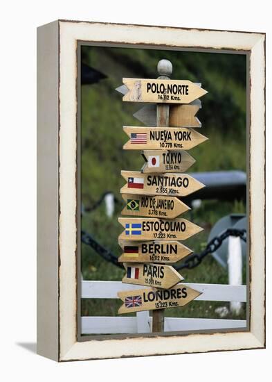 Mileage Sign Pointing Directions in Puerto Williams-Paul Souders-Framed Premier Image Canvas