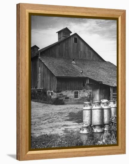 Milk Cans Being Stored on a Farm-null-Framed Premier Image Canvas
