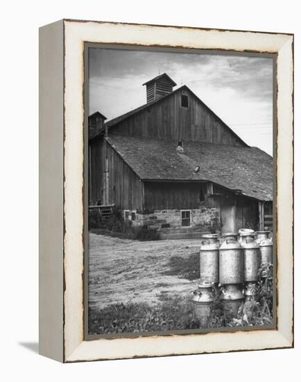 Milk Cans Being Stored on a Farm-null-Framed Premier Image Canvas