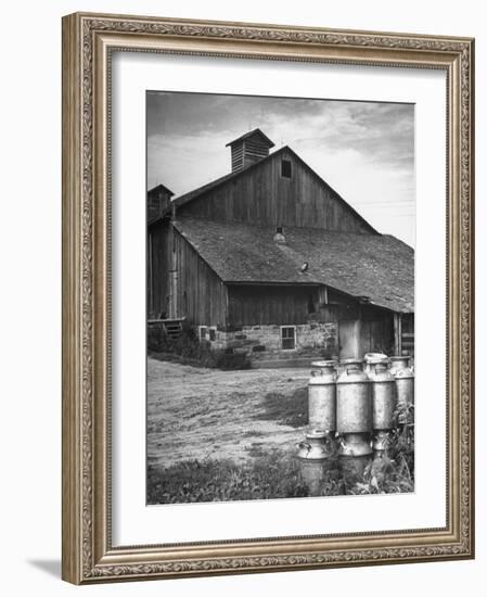 Milk Cans Being Stored on a Farm-null-Framed Photographic Print