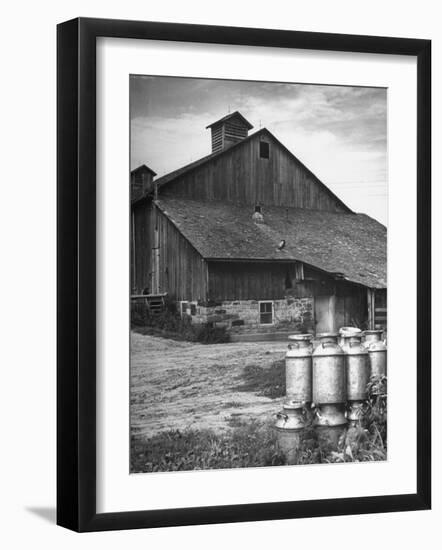 Milk Cans Being Stored on a Farm-null-Framed Photographic Print