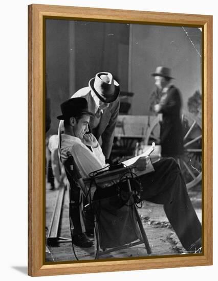 Millionaire Howard Hughes/Movie Studio Owner Studying Script on the Movie Set for "The Outlaw"-Bob Landry-Framed Premier Image Canvas