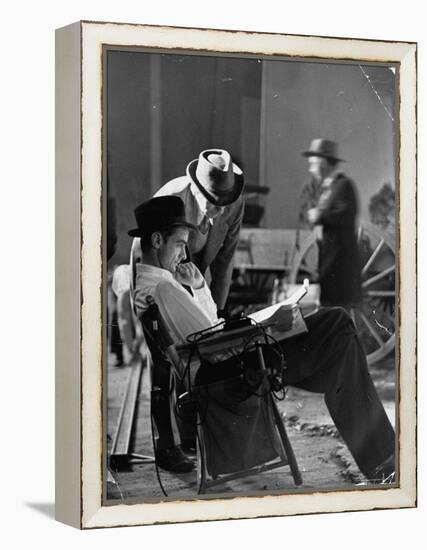 Millionaire Howard Hughes/Movie Studio Owner Studying Script on the Movie Set for "The Outlaw"-Bob Landry-Framed Premier Image Canvas