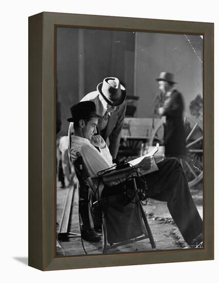 Millionaire Howard Hughes/Movie Studio Owner Studying Script on the Movie Set for "The Outlaw"-Bob Landry-Framed Premier Image Canvas