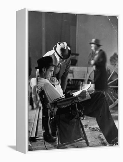 Millionaire Howard Hughes/Movie Studio Owner Studying Script on the Movie Set for "The Outlaw"-Bob Landry-Framed Premier Image Canvas