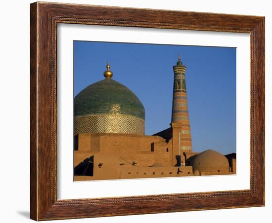 Minaret and Tiled Dome of a Mosque Rise Above the Old City of Khiva-Antonia Tozer-Framed Photographic Print